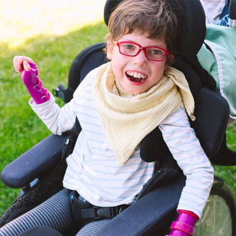 Girl smiling in wheelchair