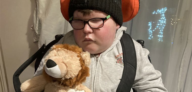 Boy in wheelchair with lion